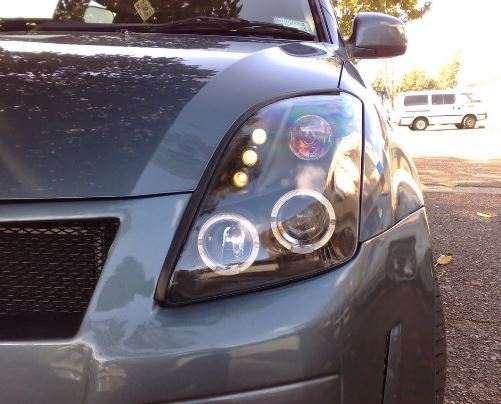SUZUKI SWIFT  2/2005-2010 BLACK ANGEL EYES HEADLIGHTS PAIR